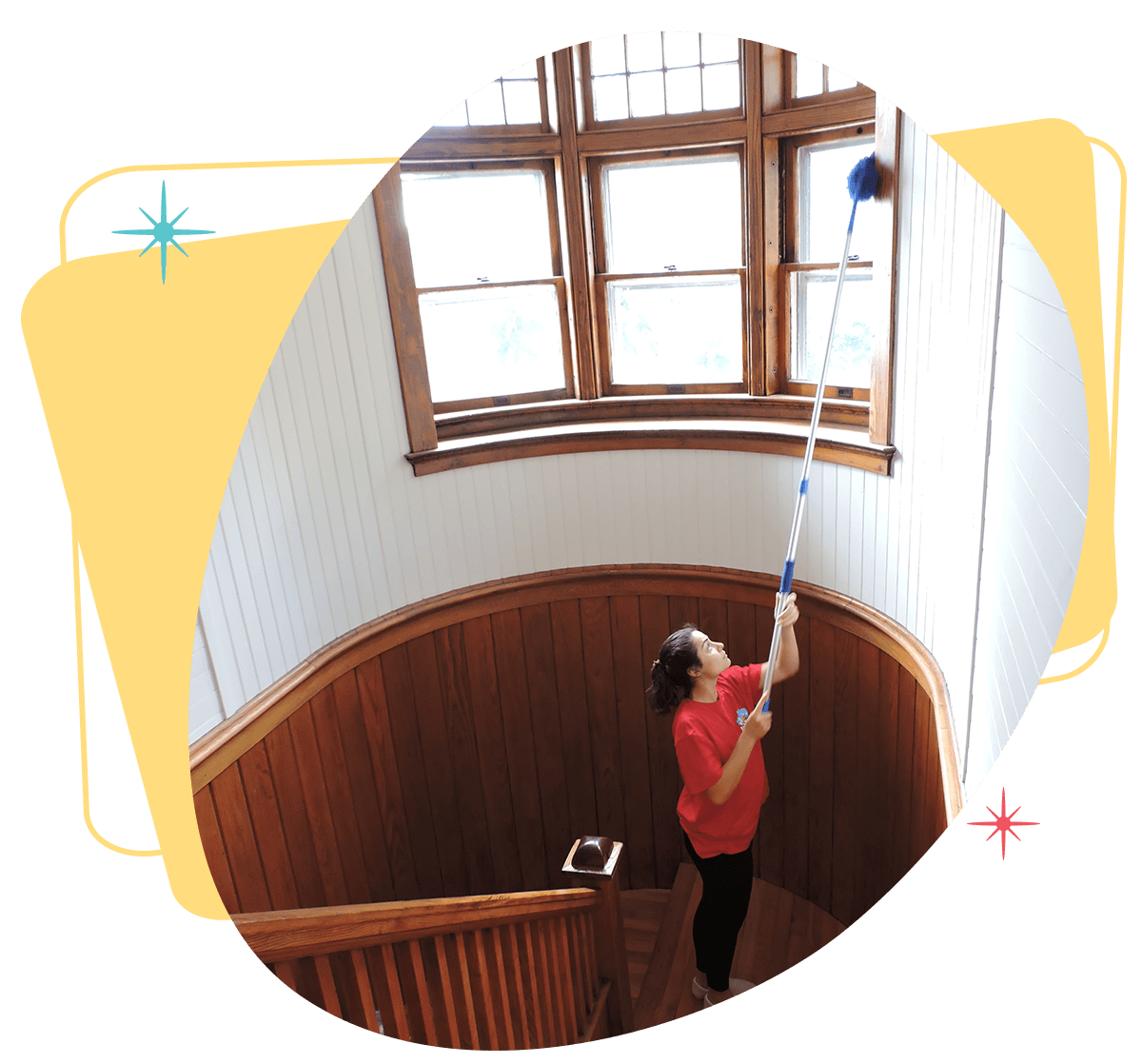 Belle Home cleaner dusting a high window